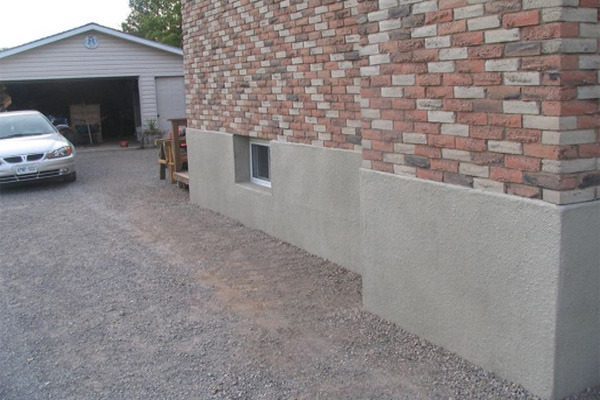 Brick exterior with finished parging along the foundation